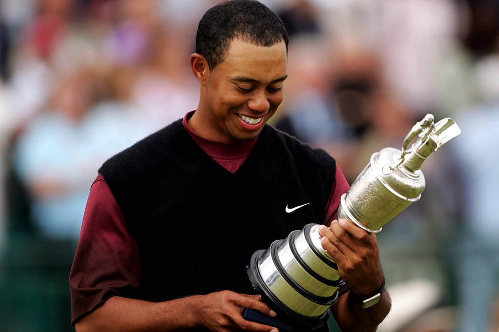 Tiger Woods admires the Claret Jug after winning The 134th Open